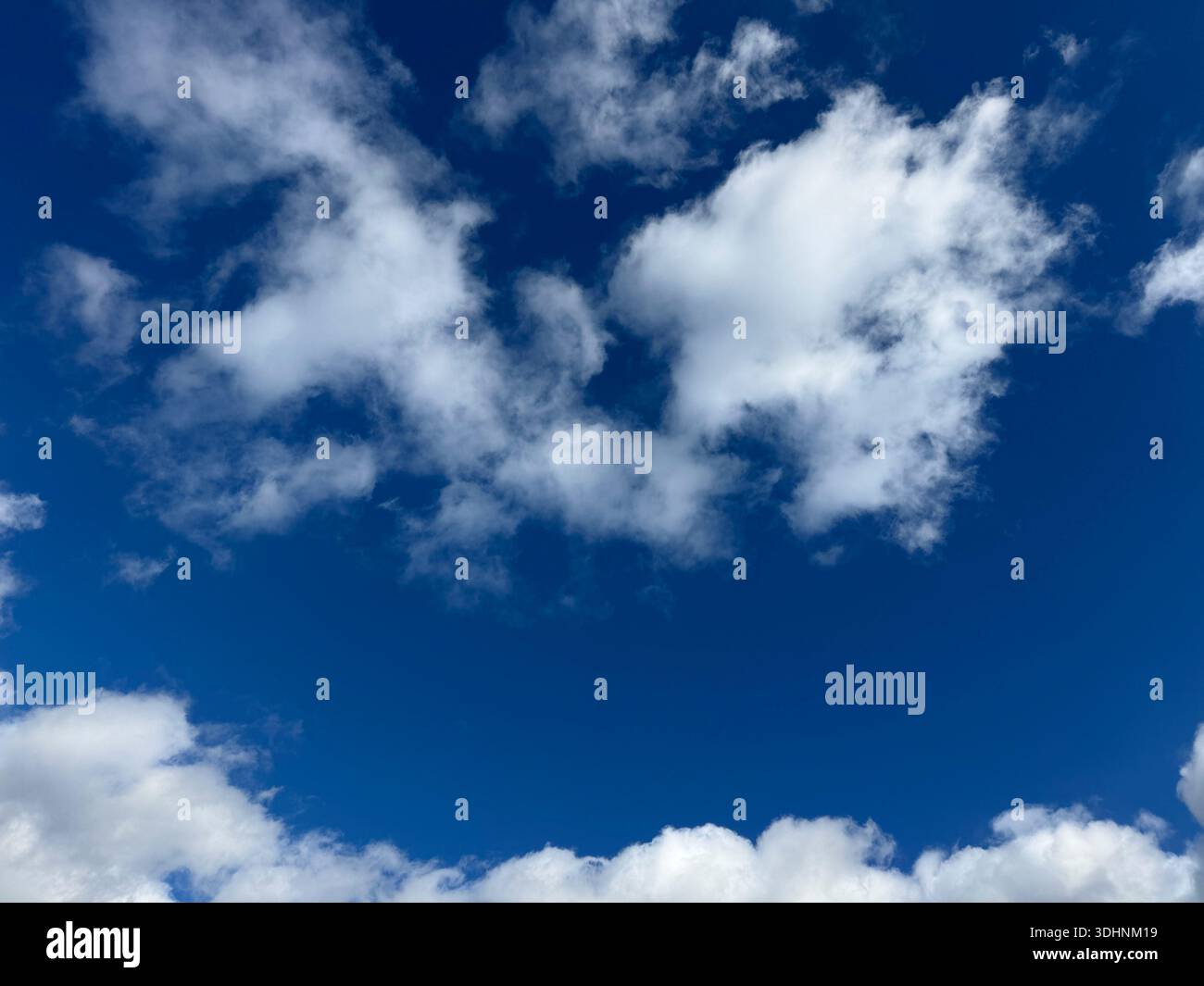 Fluffy clouds in the blue sky Stock Photo