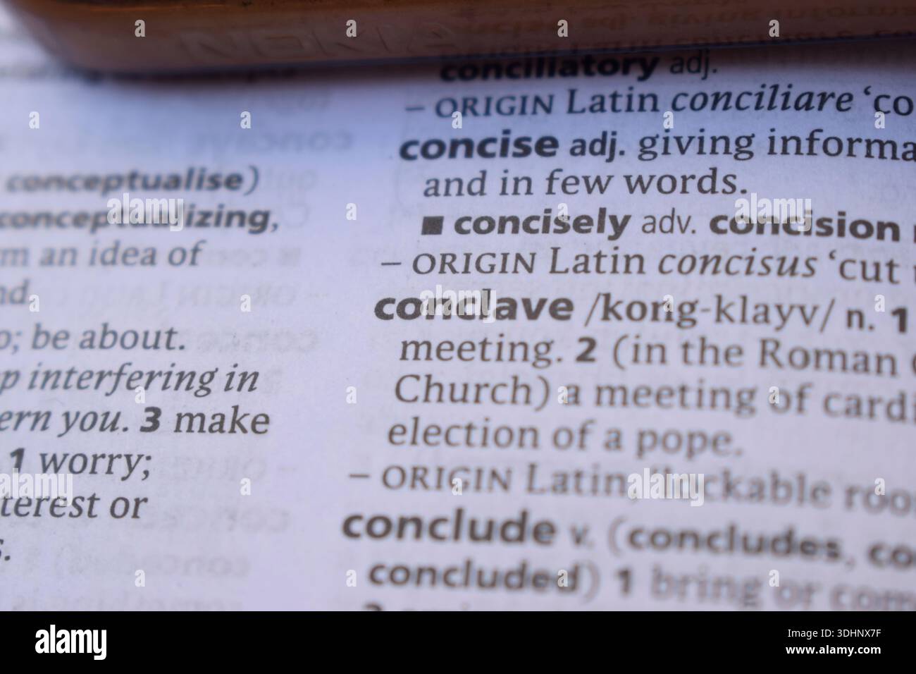 Definition Of English Dictionary Close Up Of Word - conclave Stock Photo