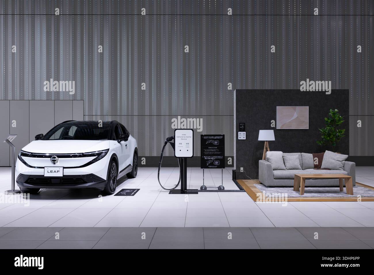 Nissan's vehicle to home charging device on display inside Nissan ...