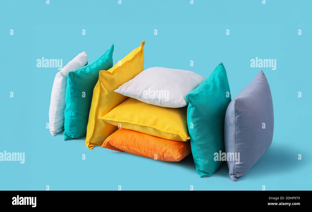 Different colorful pillows on blue background Stock Photo