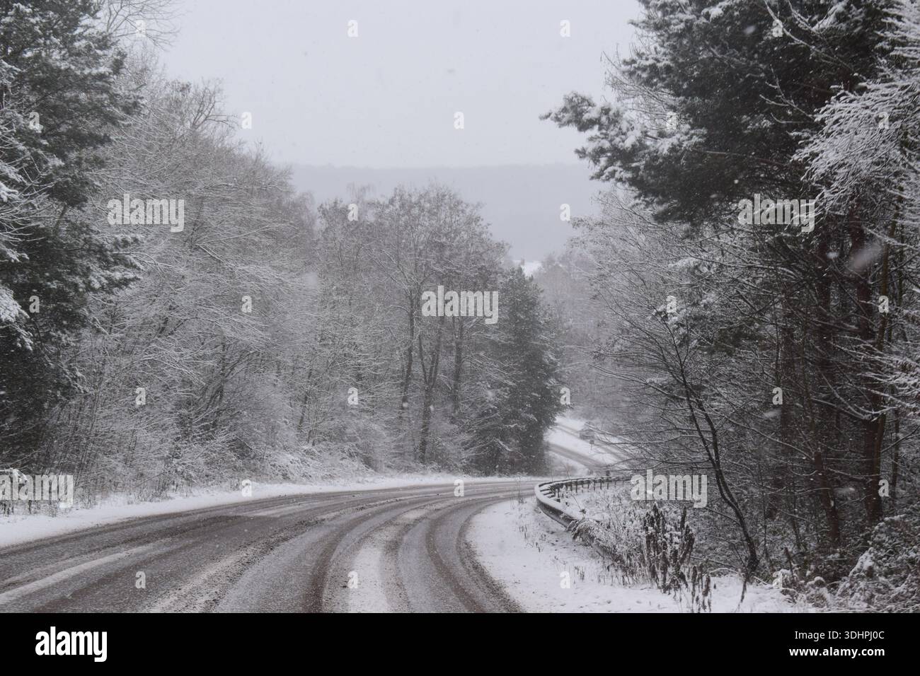 snowy curve through a valley in France Stock Photo