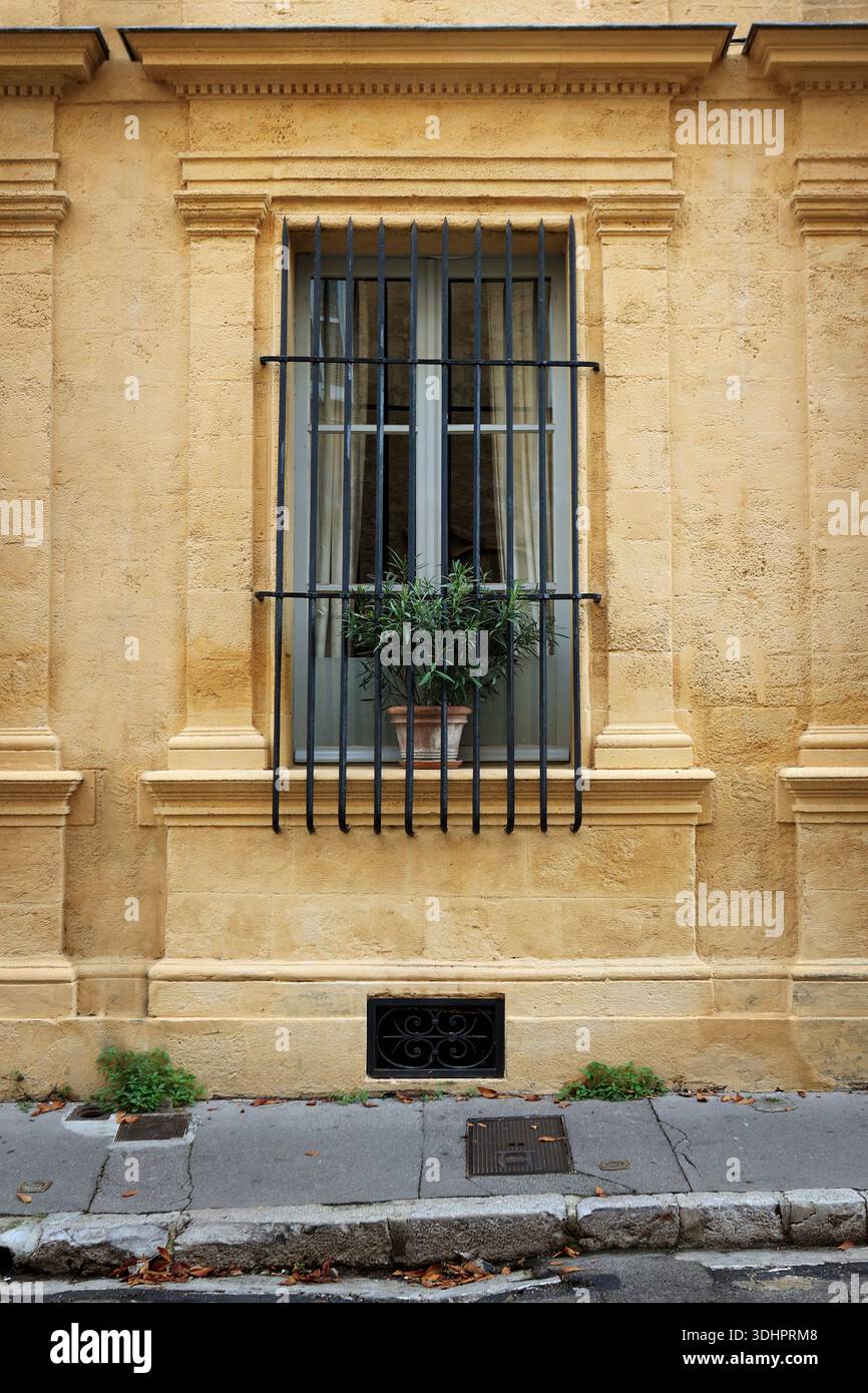 Window with fence of stone building in provence Stock Photo