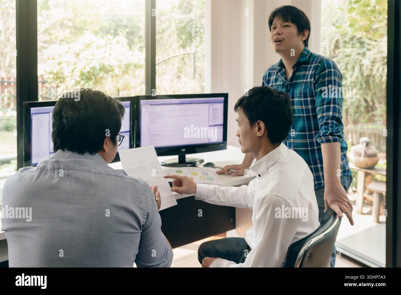 Programmers team working in a software developing. Developing programming and coding technologies. Website design. Cyber space concept. Stock Photo