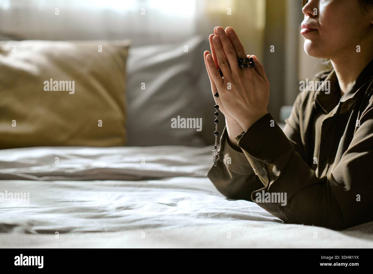 Asian woman kneeling in bedroom hi-res stock photography and images - Alamy