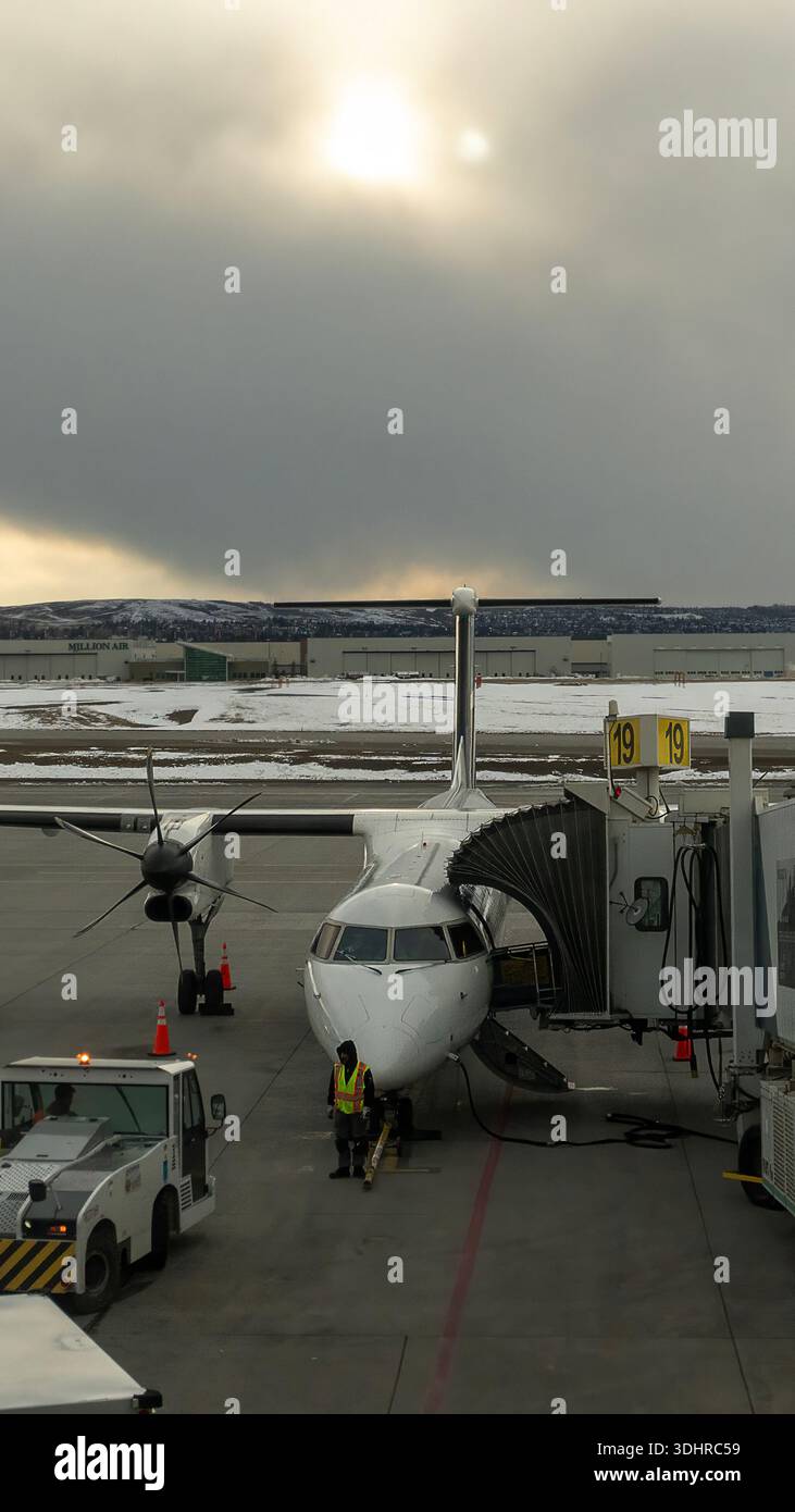 A 9:16 Portrait image of a Westjet De Havilland Dash 8-400 at Calgary Airport in Alberta, Canada - Stock Image