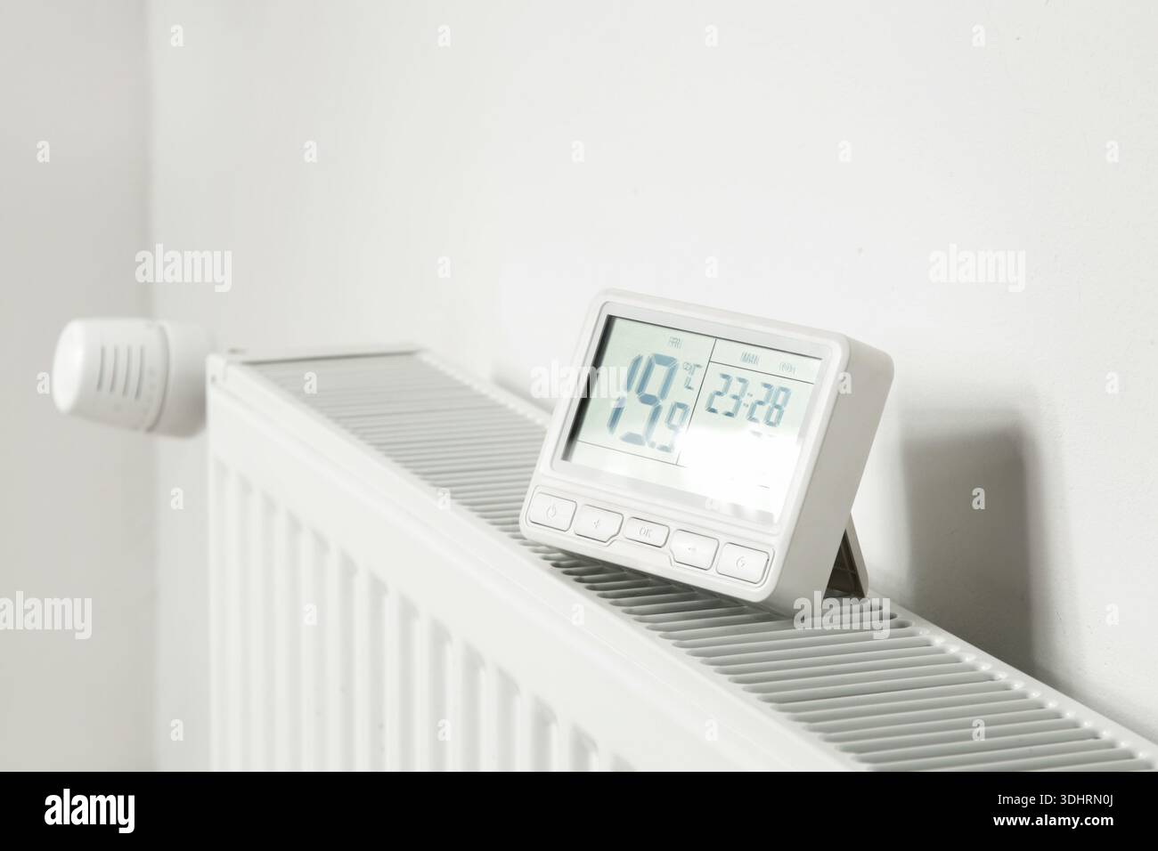 Programmable Thermostat for Home Heating and Cooling Control Stock Photo