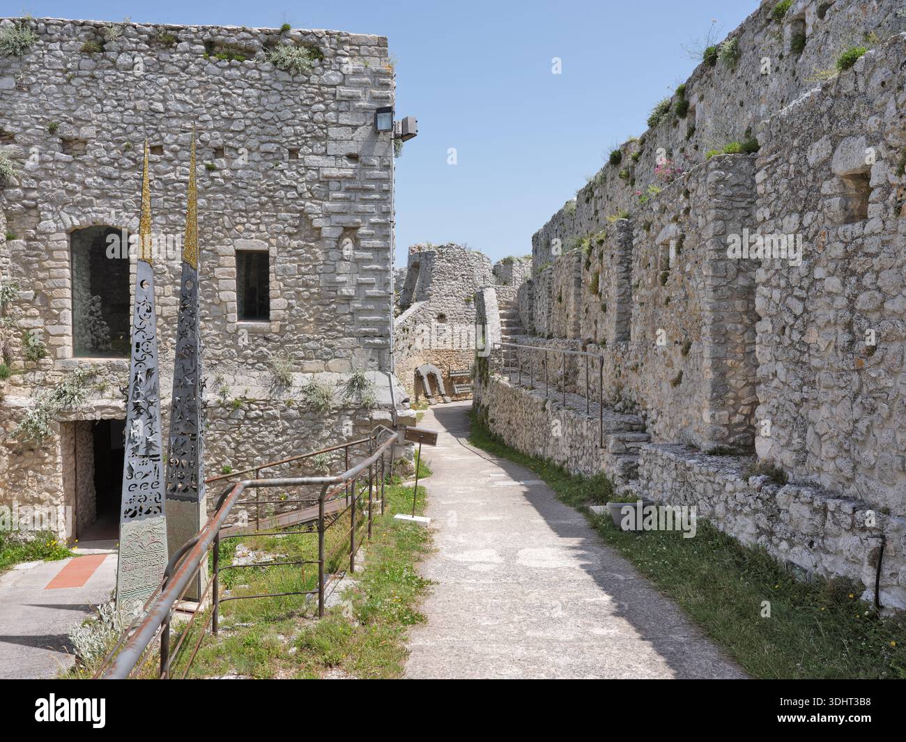 Ancient stone walls and a pathway winding through the Norman Castle in Monte Sant’Angelo. Stock Photo