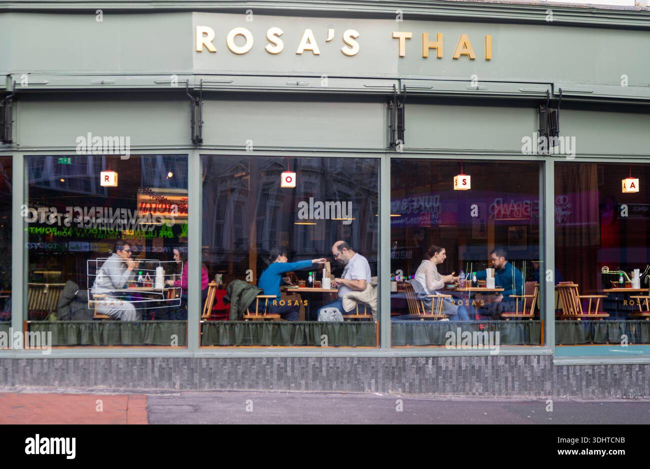 People eating at tables inside Rosa's Thai restaurant, Kings Road, Reading, Berkshire, England, UK Stock Photo