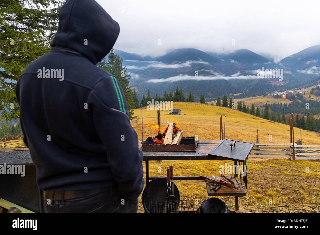 Man starting campfire grill hi-res stock photography and images - Alamy