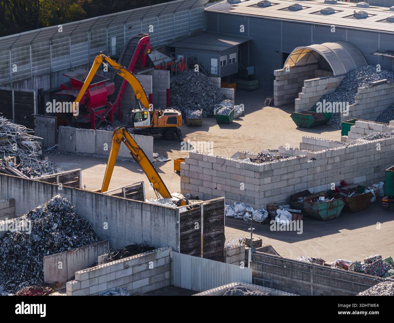 Aerial view of a scrap metal recycling facility with heavy machinery ...