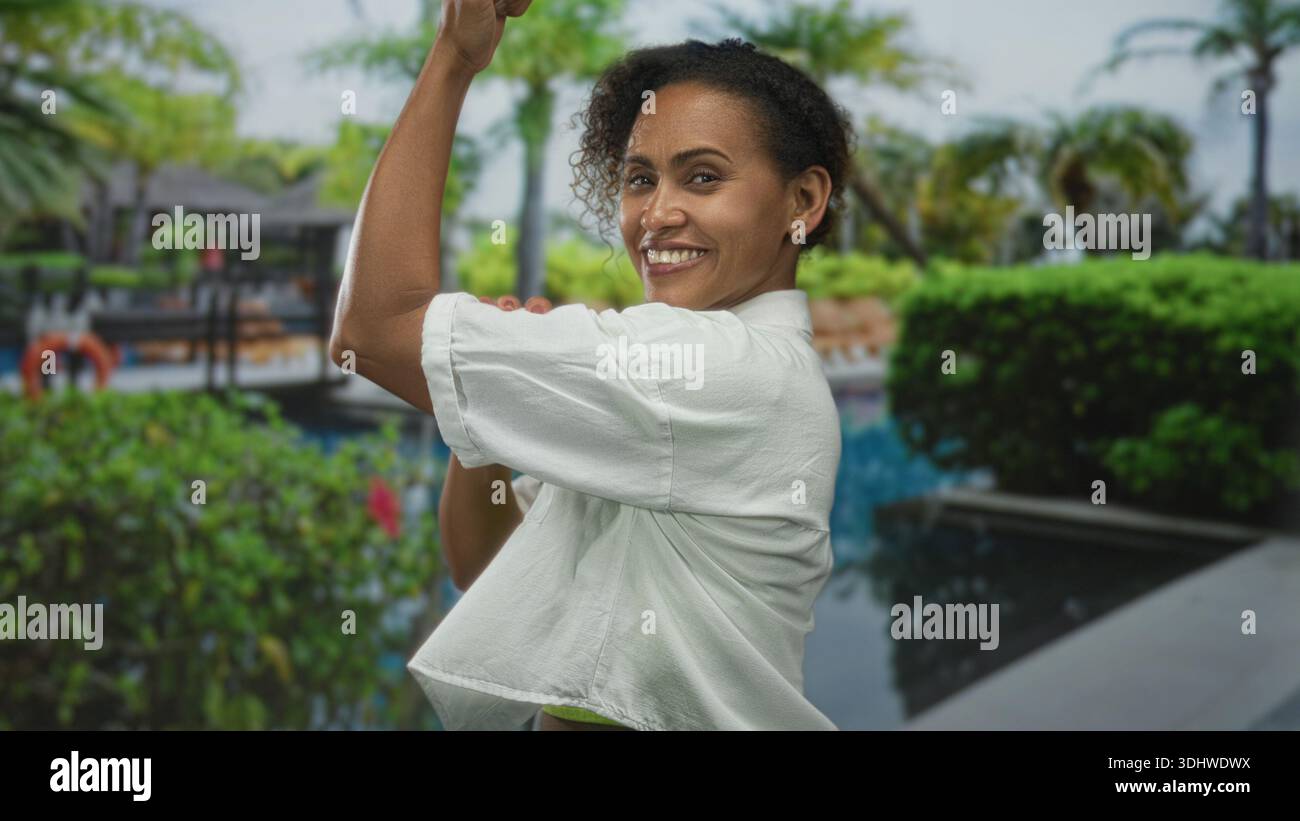 Woman flexing bicep in hotel hi-res stock photography and images - Alamy