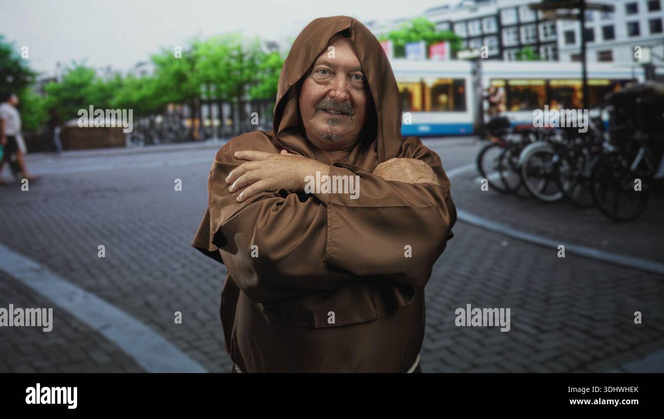 Man monk in brown hooded robe with hands crossed over chest on a 
