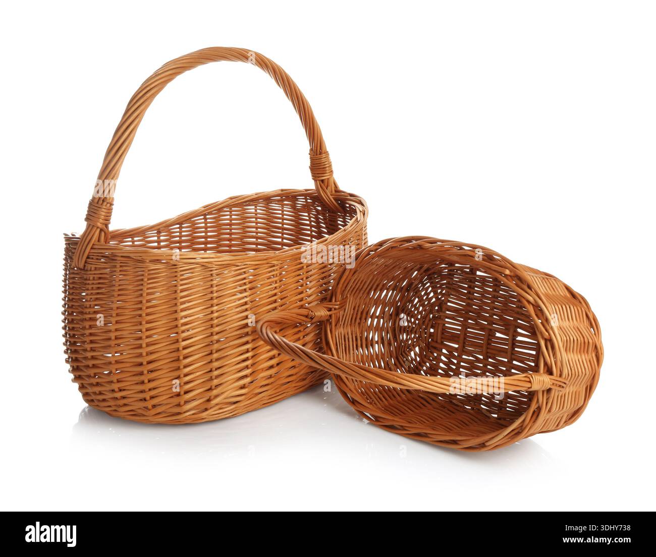 Two empty wicker baskets isolated on white Stock Photo