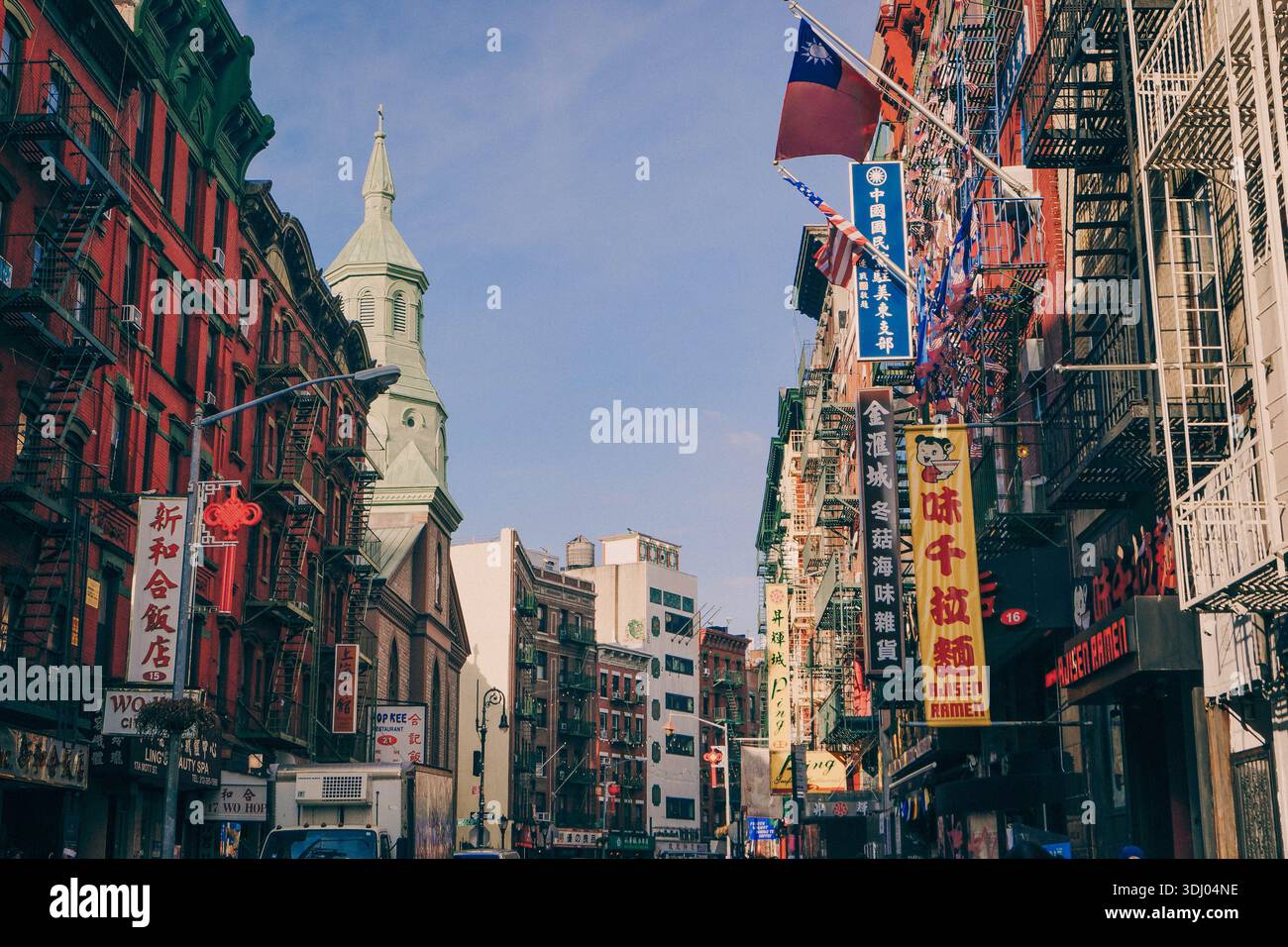 Chinatown street in New York, hub of Chinese diaspora and Asian immigrants in multicultural America, embodying overseas Chinese community life. Stock Photo