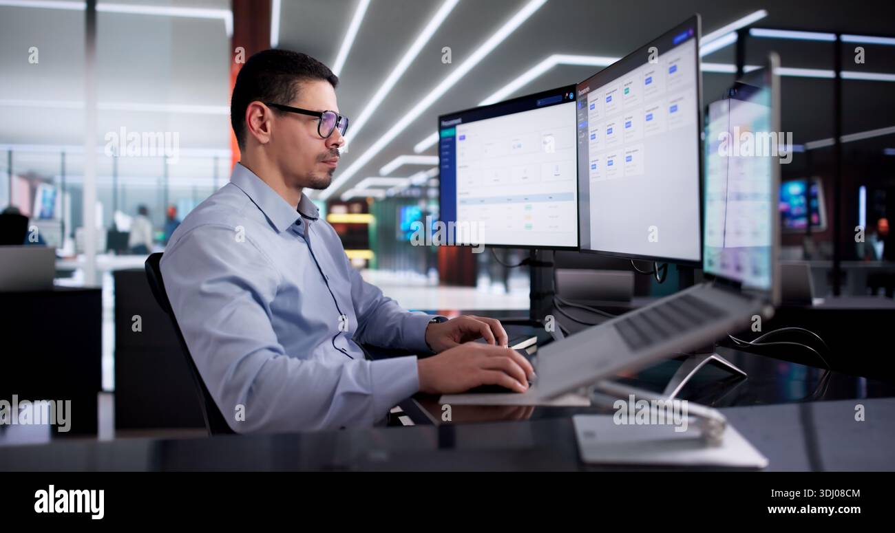 Man Using Online Document Management Software For Efficient Contract Storage. Stock Photo