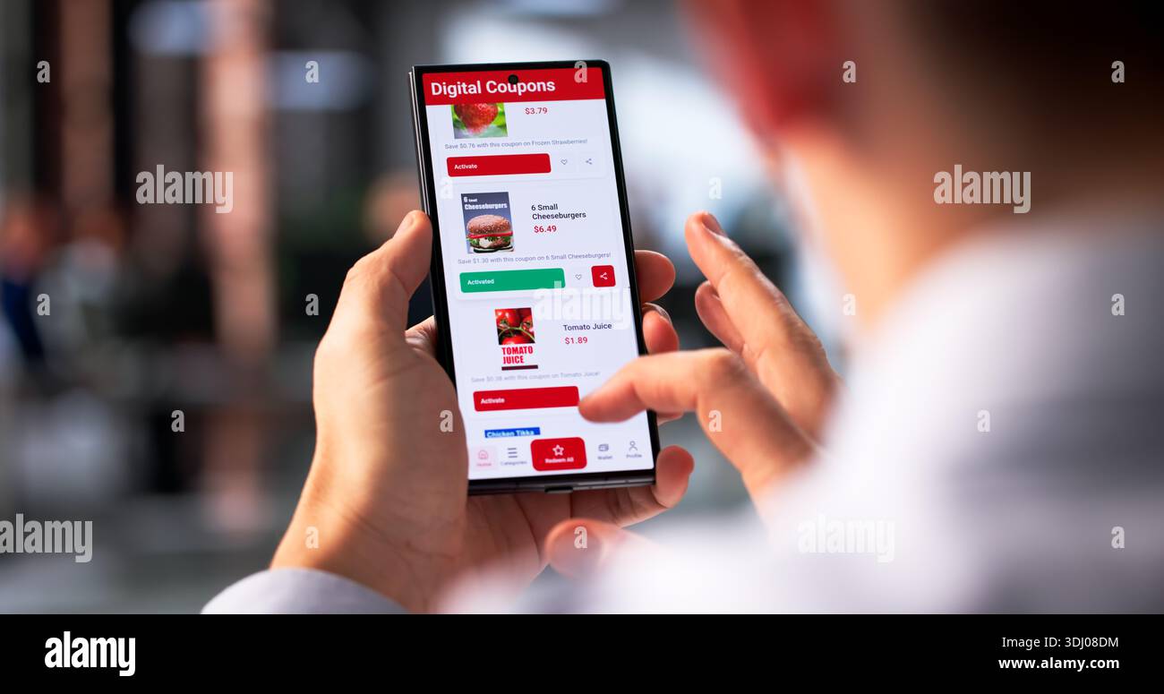 Hispanic Man Saving Money: Using Smartphone To Shop Online Stock Photo
