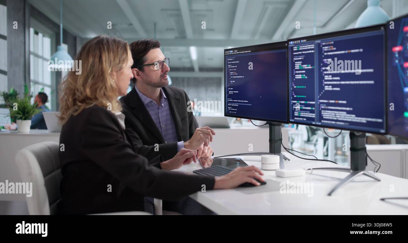Team Of Programmers In Office Developing Cybersecurity Software Program Stock Photo