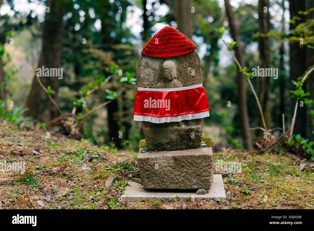 Roadside shrine with jizo statue hi-res stock photography and