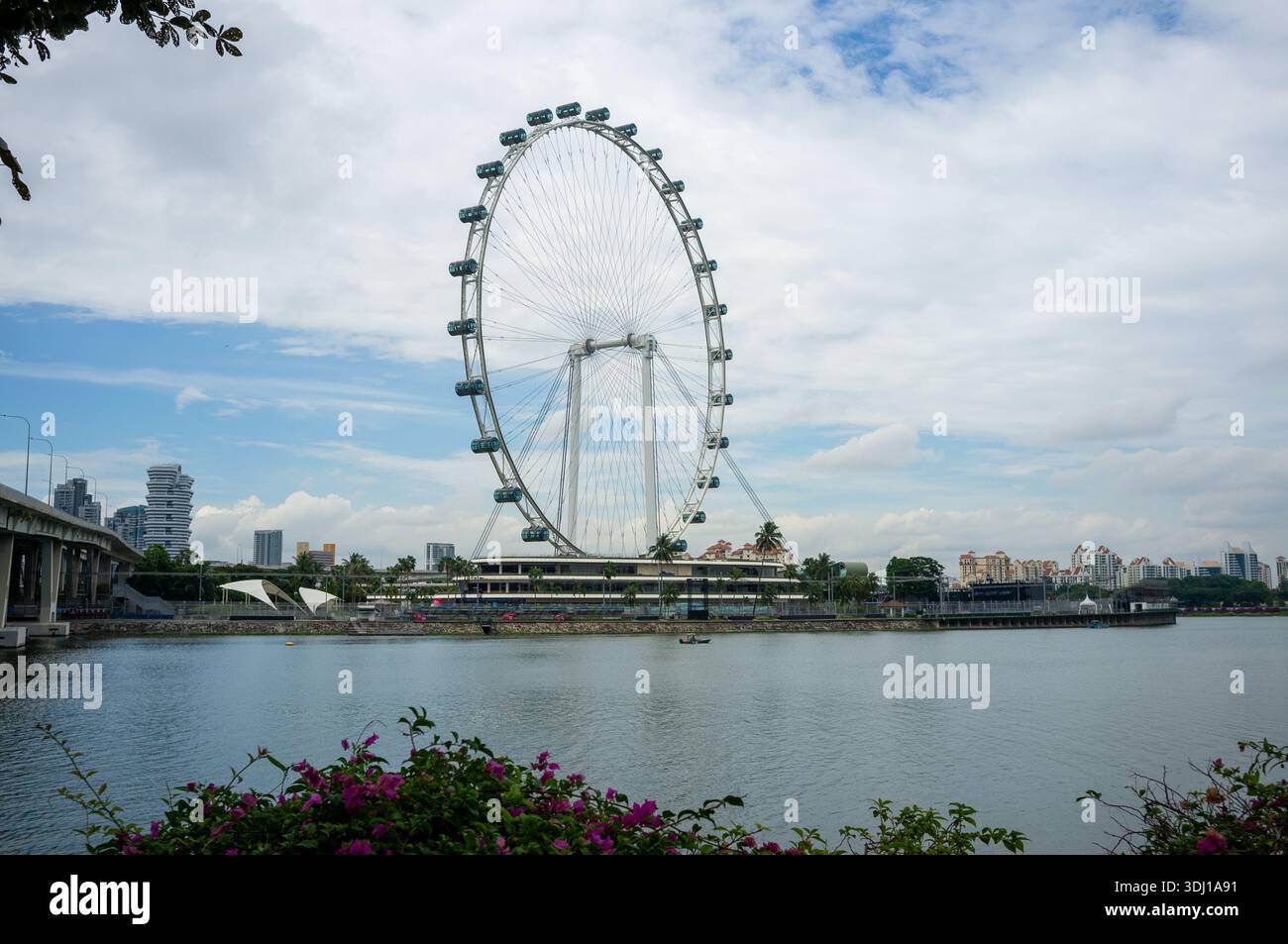 The Singapore Flyer as scene across the Marina Bay reservoir Stock Photo