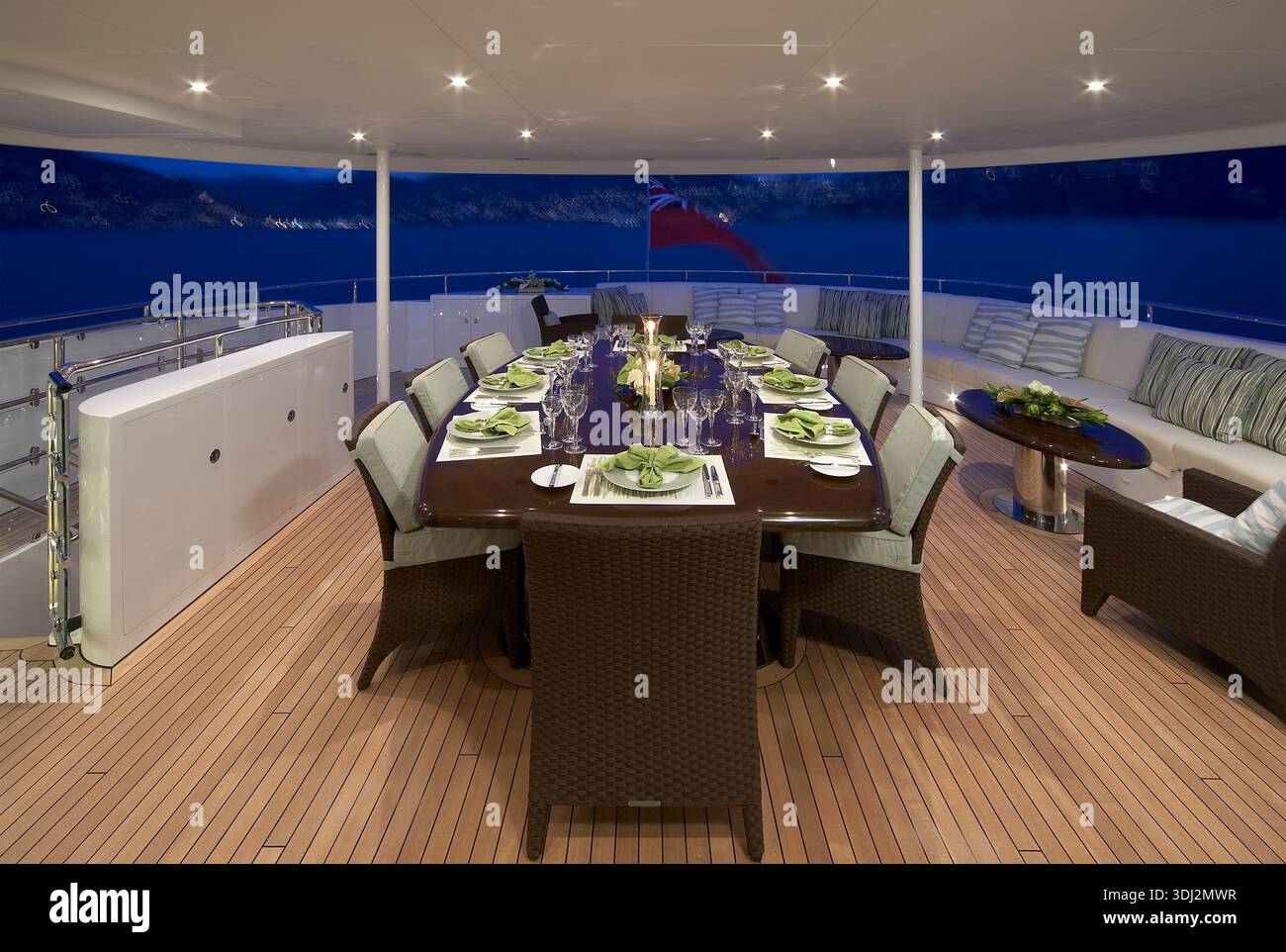 Luxurious Yacht Outdoor Dining On a Long Table Under Night Sky With ...