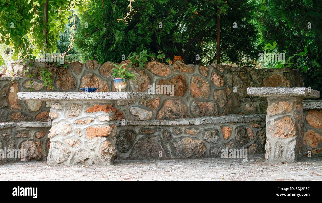 Stone Bench Sanctuary in the Garden Shade Stock Photo