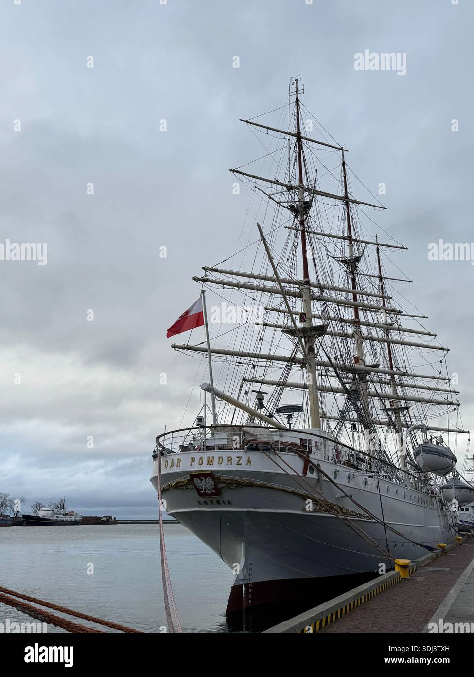 Historic Polish tall ship Dar Pomorza moored at harbor under overcast sky, Gdynia, Poland. - Smartphone Captured Stock Image