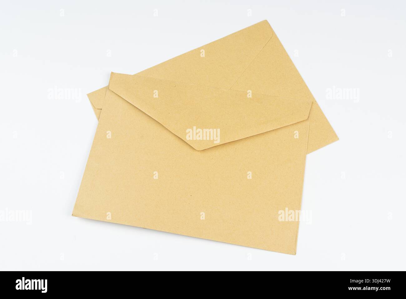 two yellow envelopes on a white surface Stock Photo