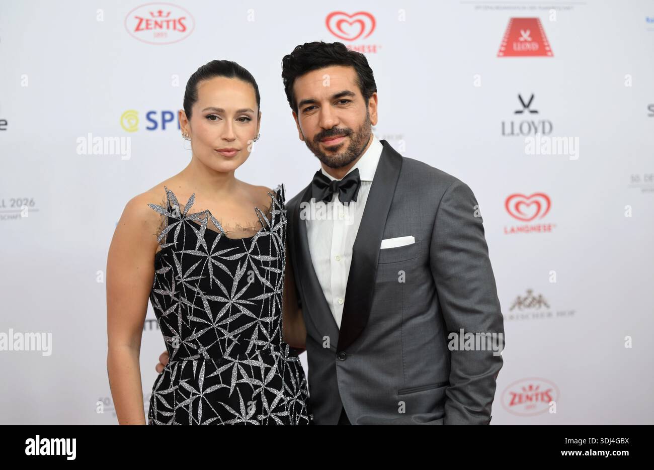 Munich, Germany. 24th Jan, 2026. Elyas M'Barek and Jessica Riso walk the red  carpet in front of the Bayerischer Hof at the 50th German Film Ball. The  leading organization of the film
