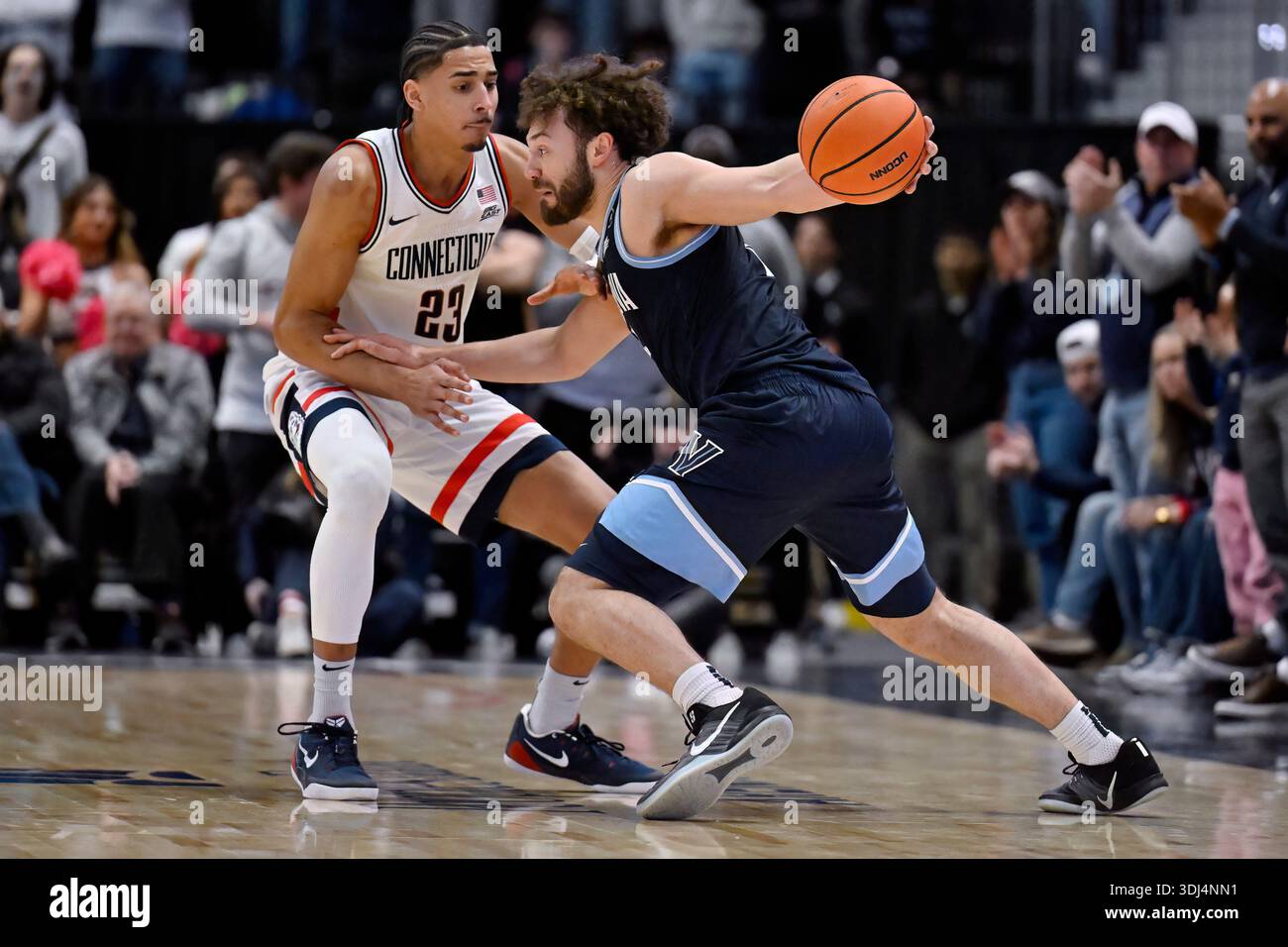 Devin Forward Villanova guard Devin Askew is guarded by UConn forward Jayden Ross (23 ...
