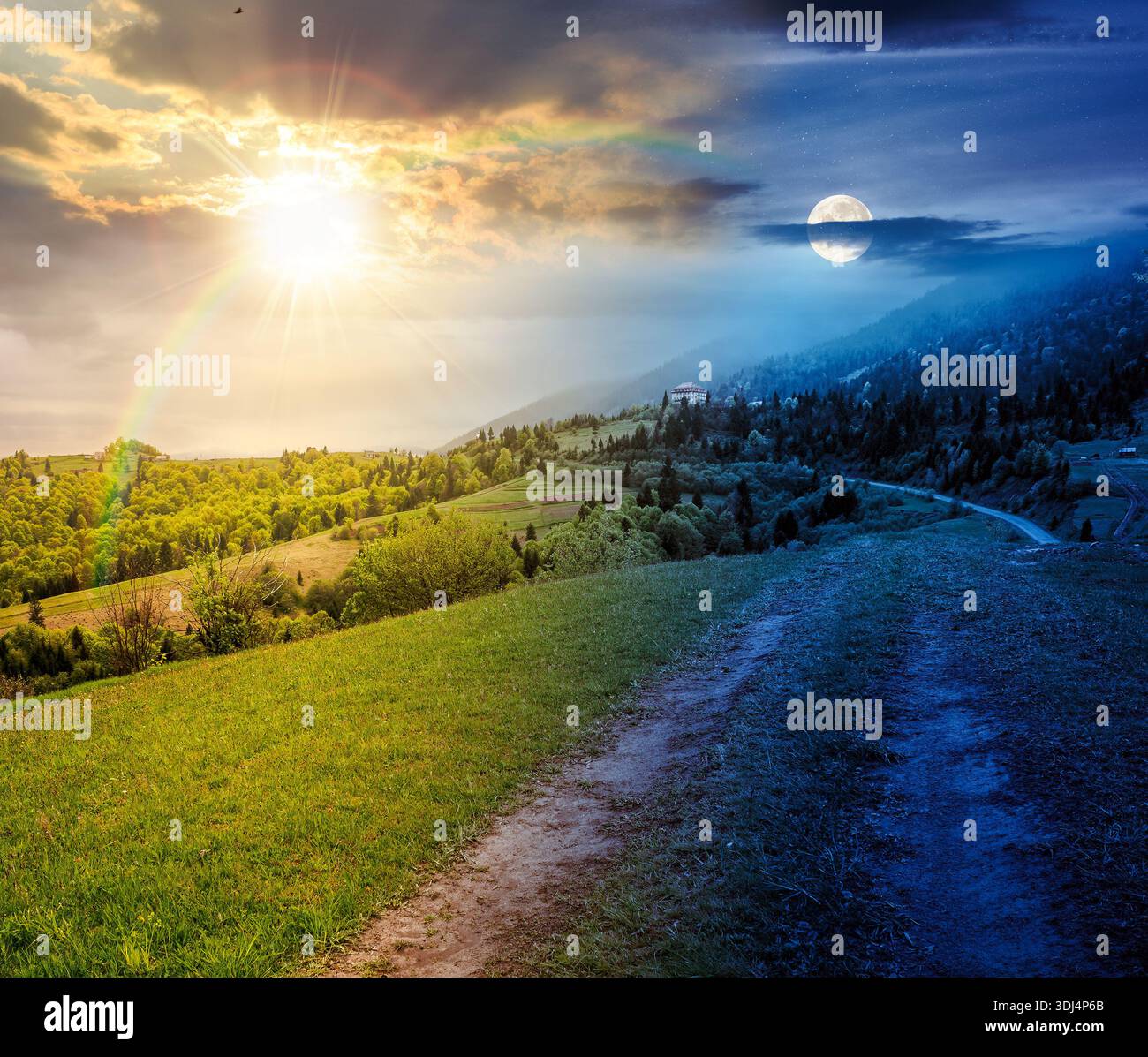 dirt road winding through green rolling hills. day and night time change concept. rural landscape in mountain range with sun and moon at twilight. cou Stock Photo