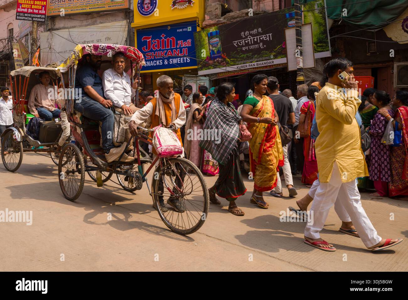 Varanasi Rickshaws Rickshaw puller woman passenger hi-res stock photography and images - Alamy