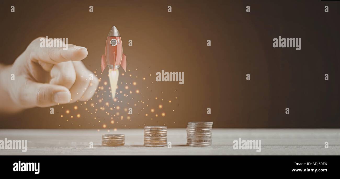An image depicting a hand launching a rocket over a stack of coins ...