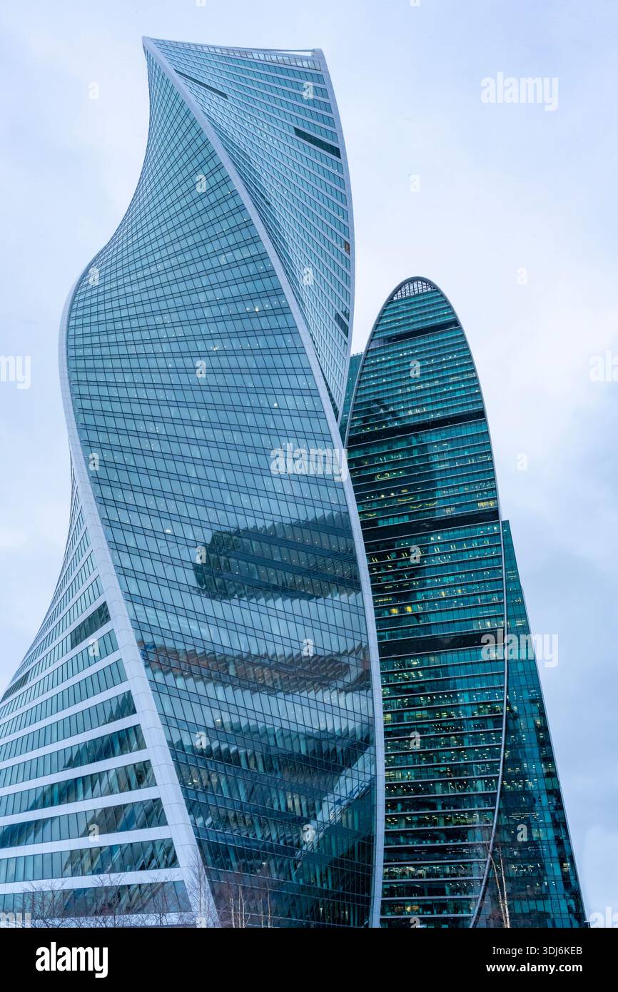 Moscow, Russia - January 18, 2022: Moscow-City is a business center in Moscow centre. The tops of modern corporate buildings in snowfall. Low angle vi Stock Photo