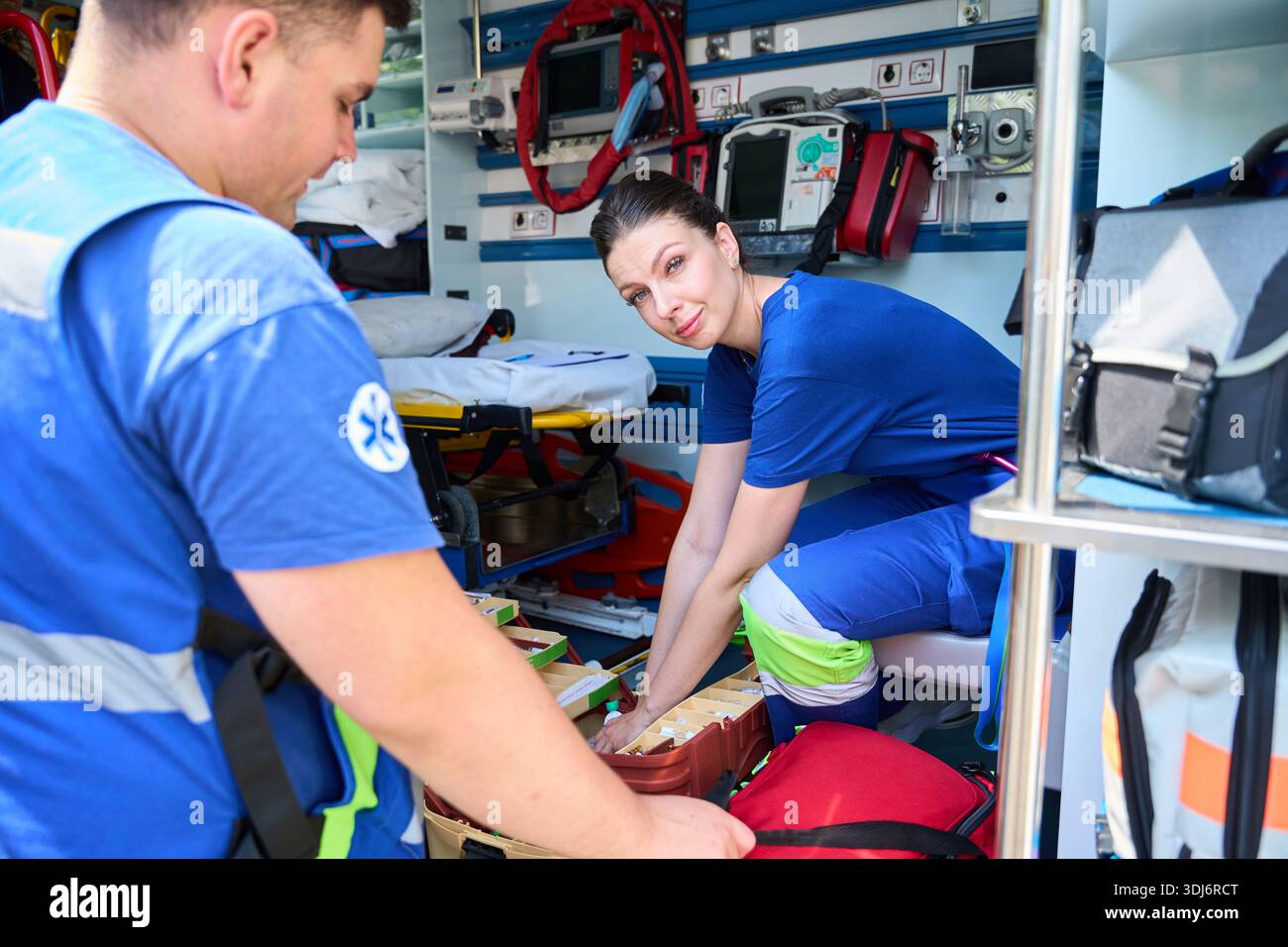 Female emergency responder preparing treatment tools Stock Photo - Alamy