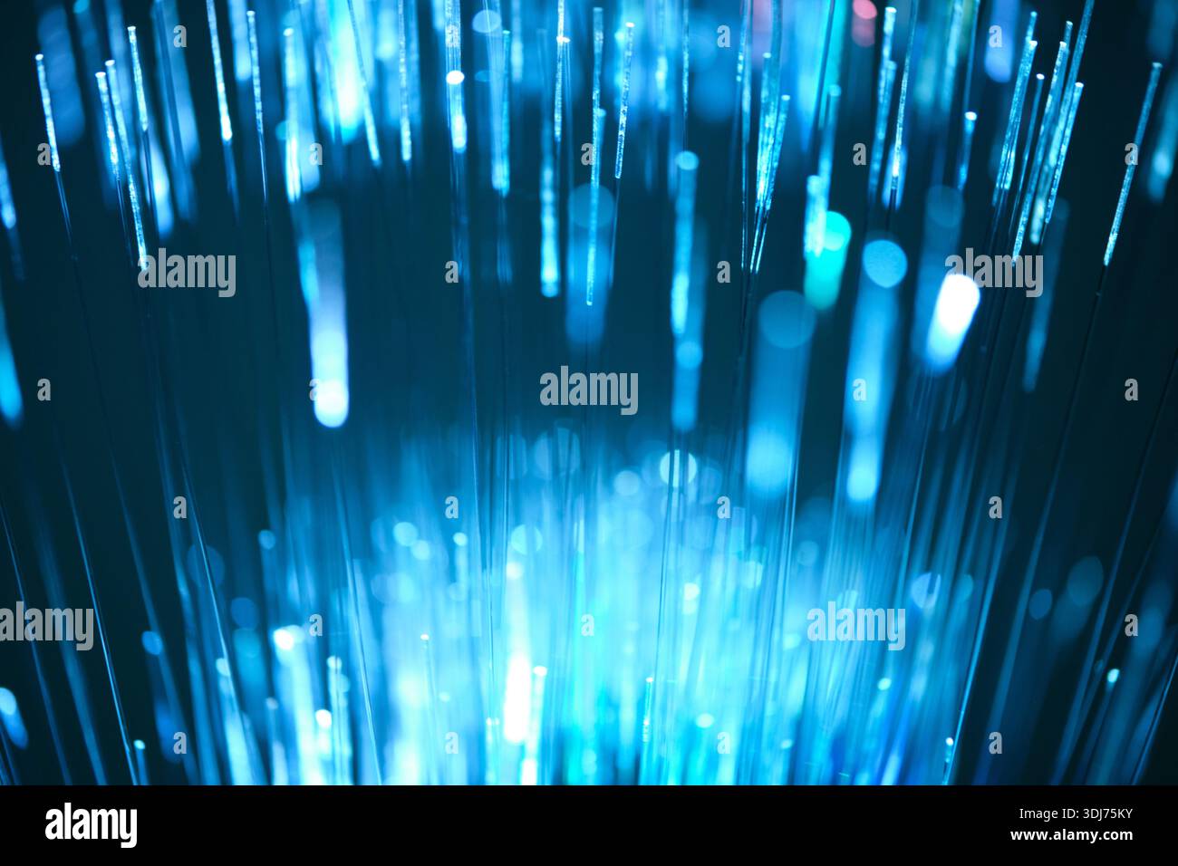 Blue glow fiber optic cable is data transmission concept Stock Photo