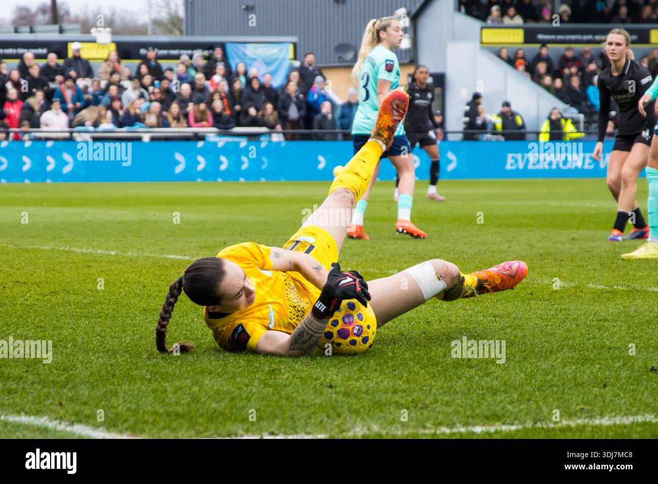 Elene Lete (77 London City Lionesses - Goalkeeper) makes a low save ...
