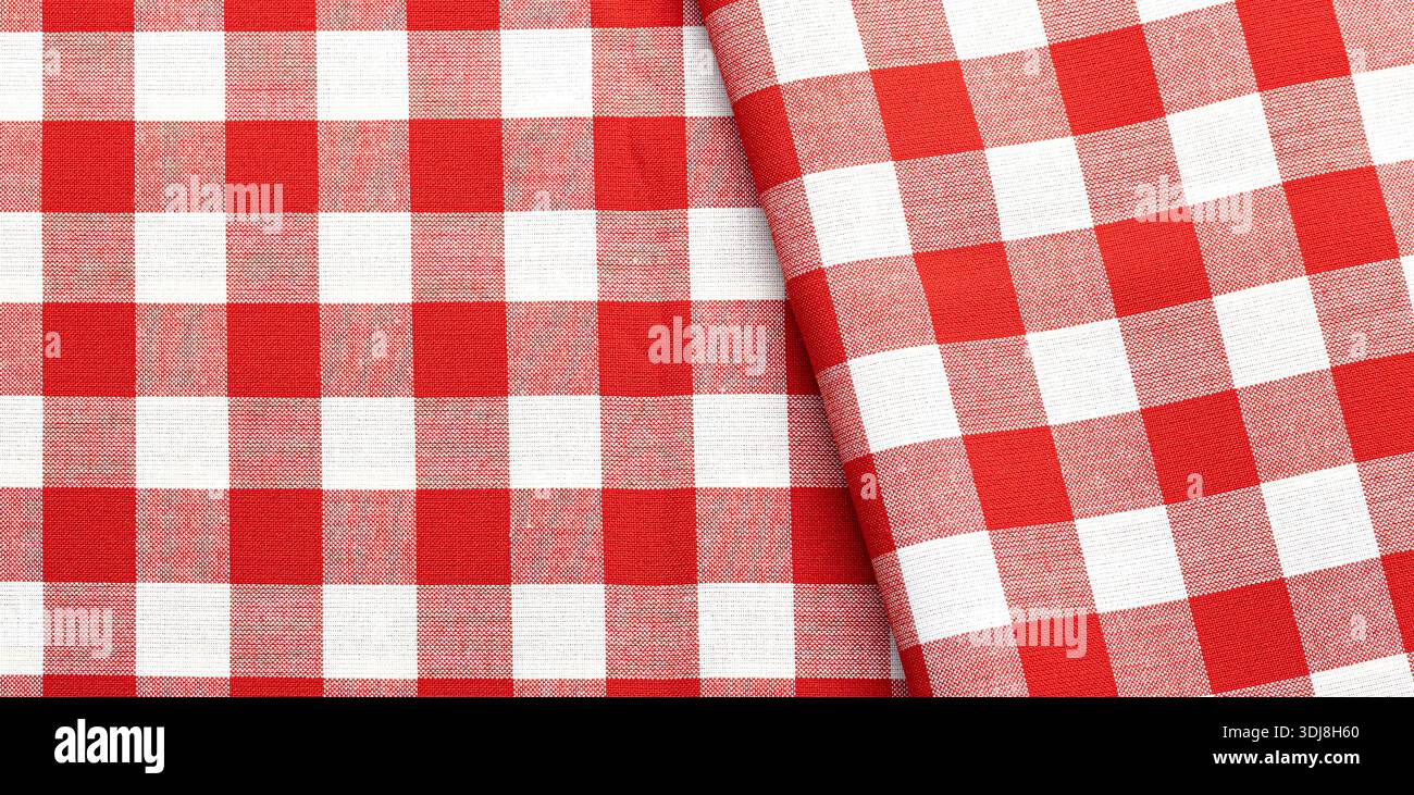 Red and white checkered fabric with folded textile texture provides a rustic background Stock Photo