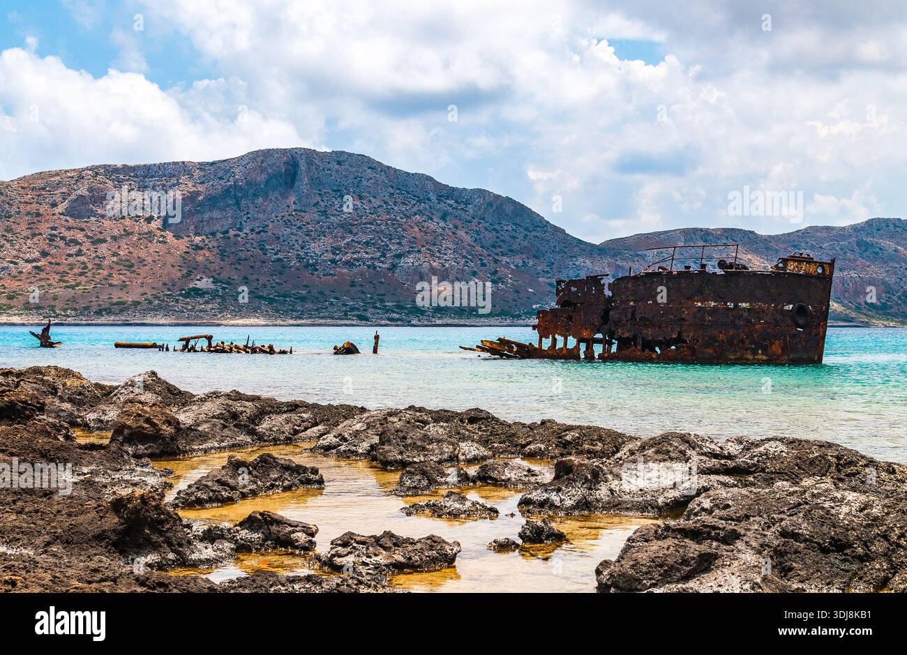 A rusty shipwreck off the coast of Imeri Gramvousa Island near Balos Bay in Crete. Stock Photo