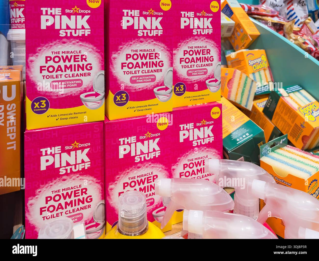 Karlstad, Sweden - October 19, 2025: The Pink Stuff Power Foaming Toilet Cleaner is featured on shelves, surrounded by various cleaning supplies and v Stock Photo