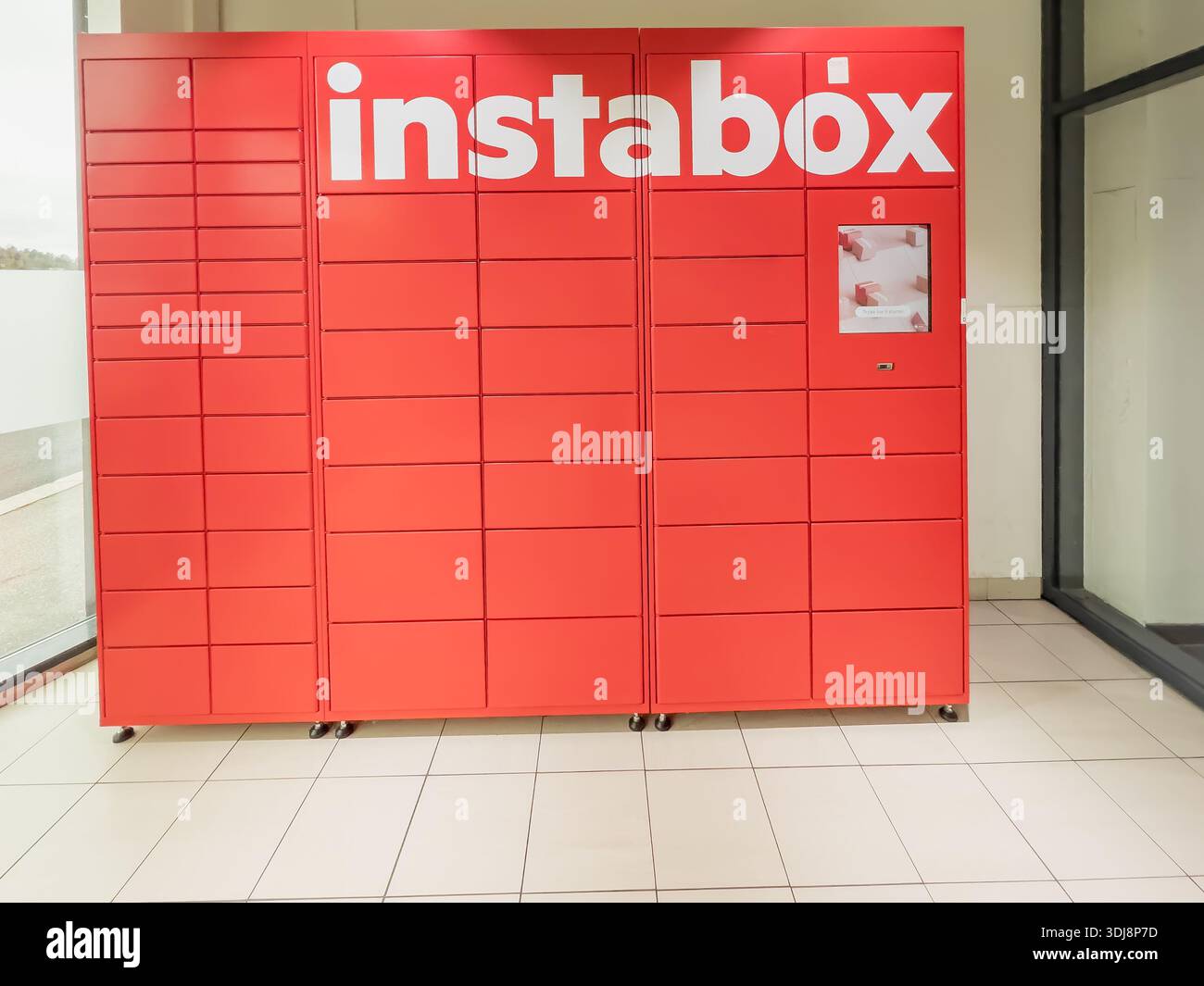 Porsgrunn, Norway - October 20, 2025: Red Instabox parcel locker system ...