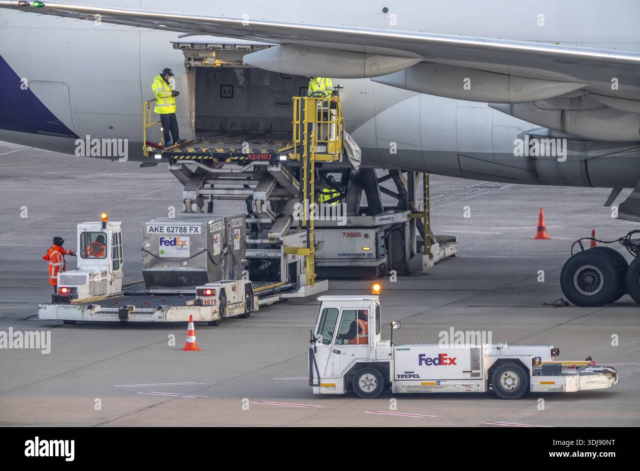FedEx Boeing 777-FS2 cargo plane is unloaded, air freight
