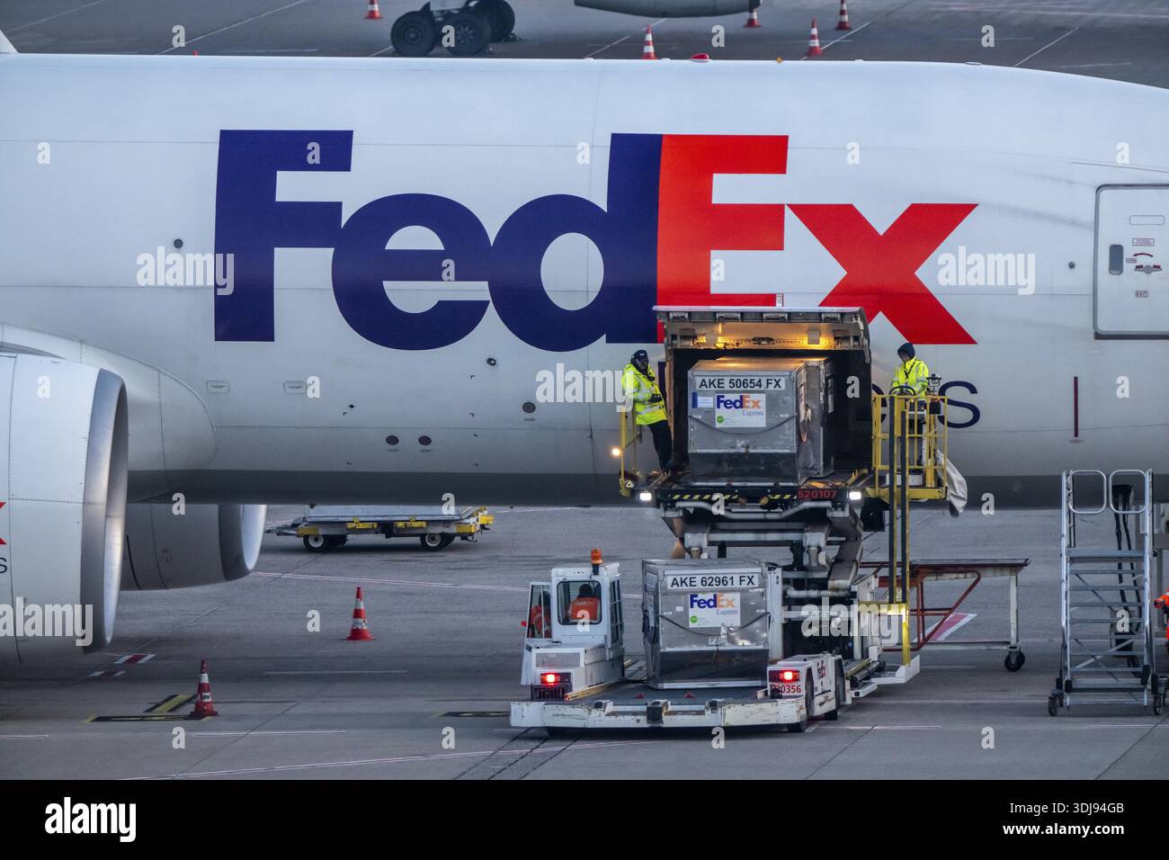 FedEx Express Boeing 777-FS2 cargo plane is unloaded, air freight