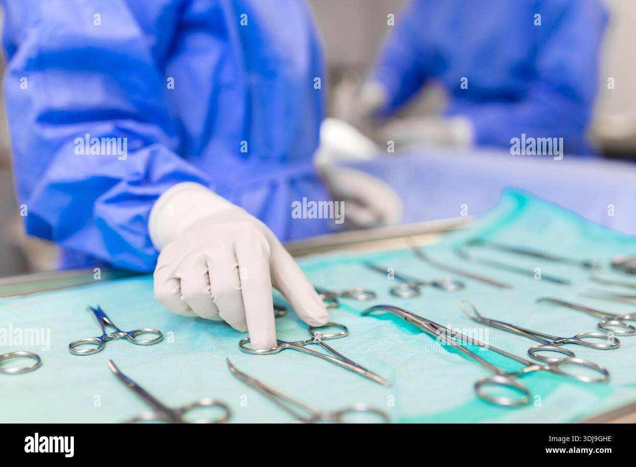 Hand Instrument Operative Nurse hand taking surgical instrument for group of surgeons at ...