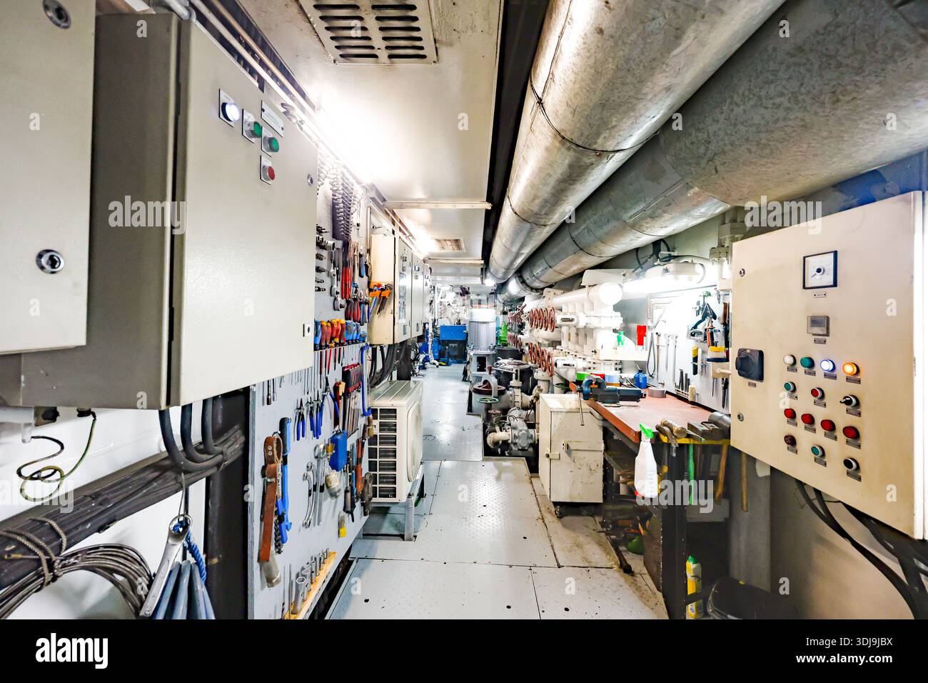 Ship Machine Shop Ship engine room corridor with control panels, tools, pipes and ...