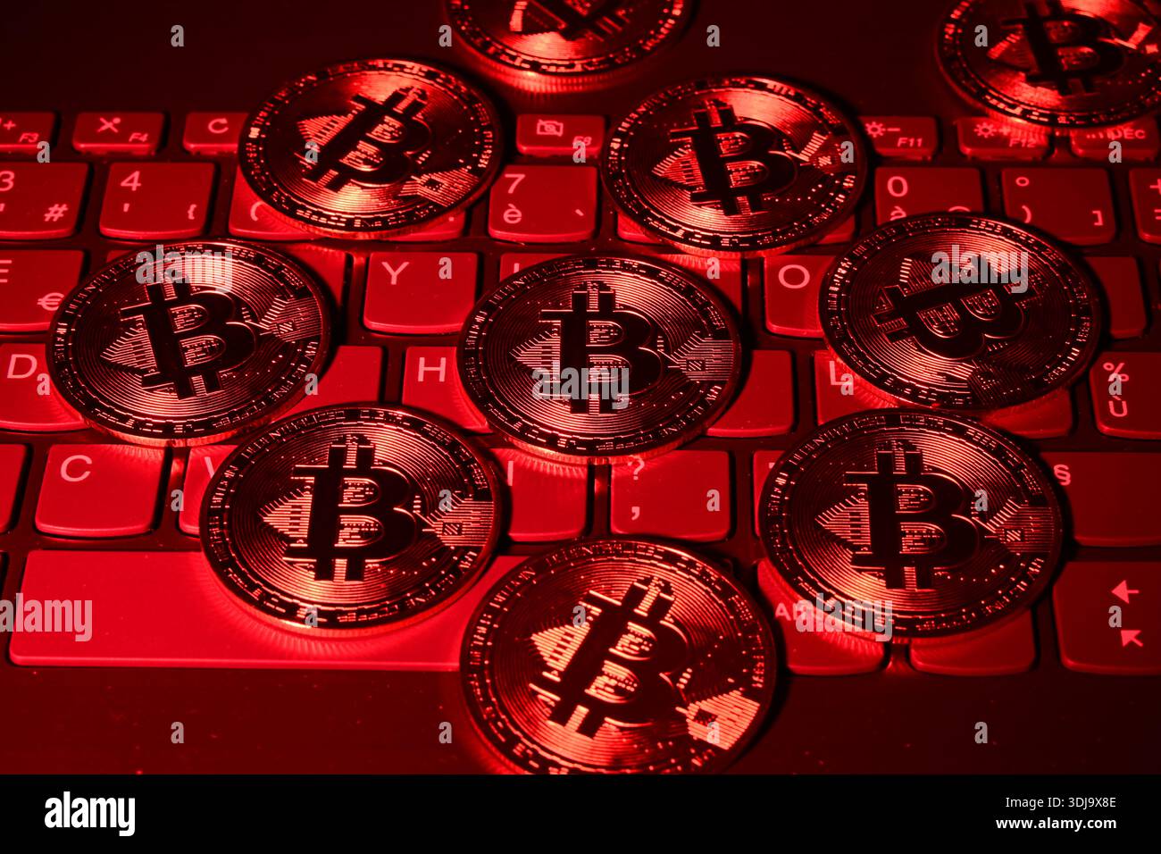 March 28, 2020, Veranne, Loire, France: Bitcoin cryptocurrency coin seen  displayed on a laptop keyboard with red ambient lighting. (Credit Image: ©  Romain Doucelin/SOPA Images via ZUMA Press Wire) EDITORIAL USAGE ONLY!