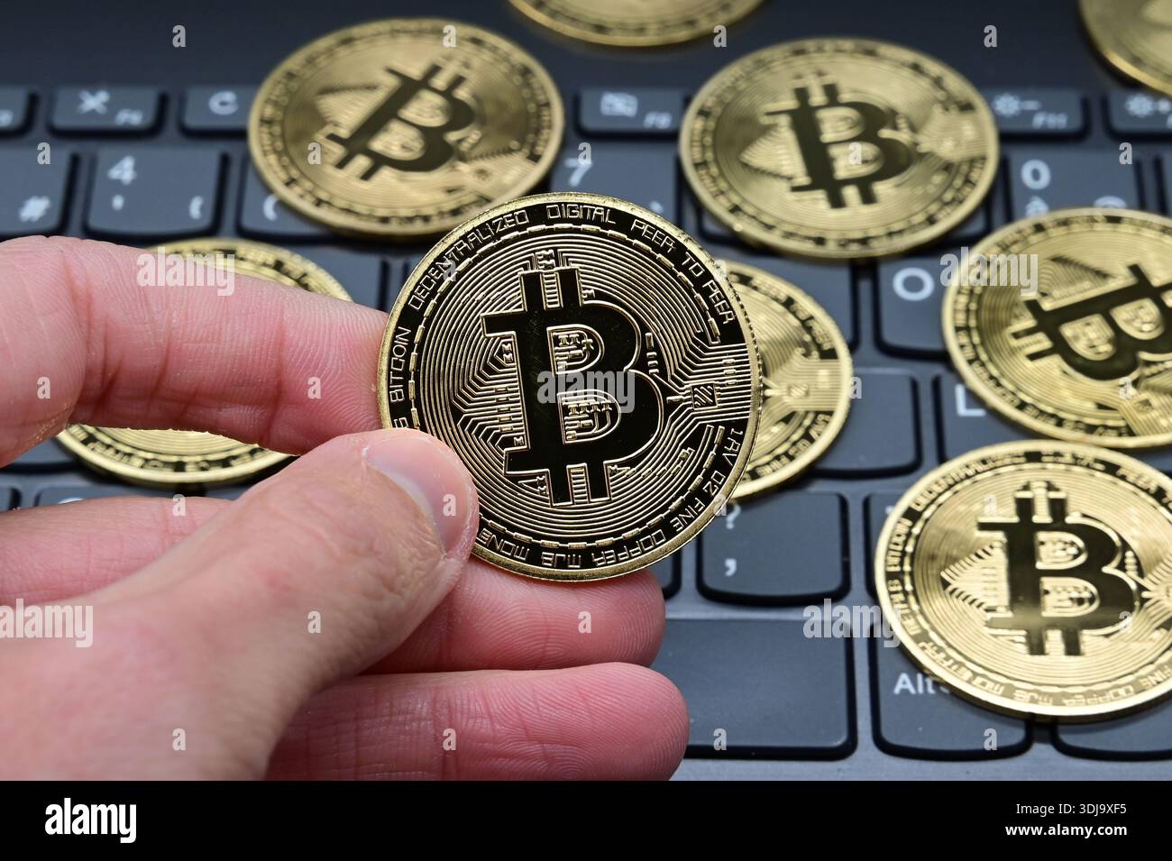 March 28, 2020, Veranne, Loire, France: Bitcoin cryptocurrency coins seen  displayed on a laptop keyboard. (Credit Image: © Romain Doucelin/SOPA  Images via ZUMA Press Wire) EDITORIAL USAGE ONLY! Not for Commercial USAGE!