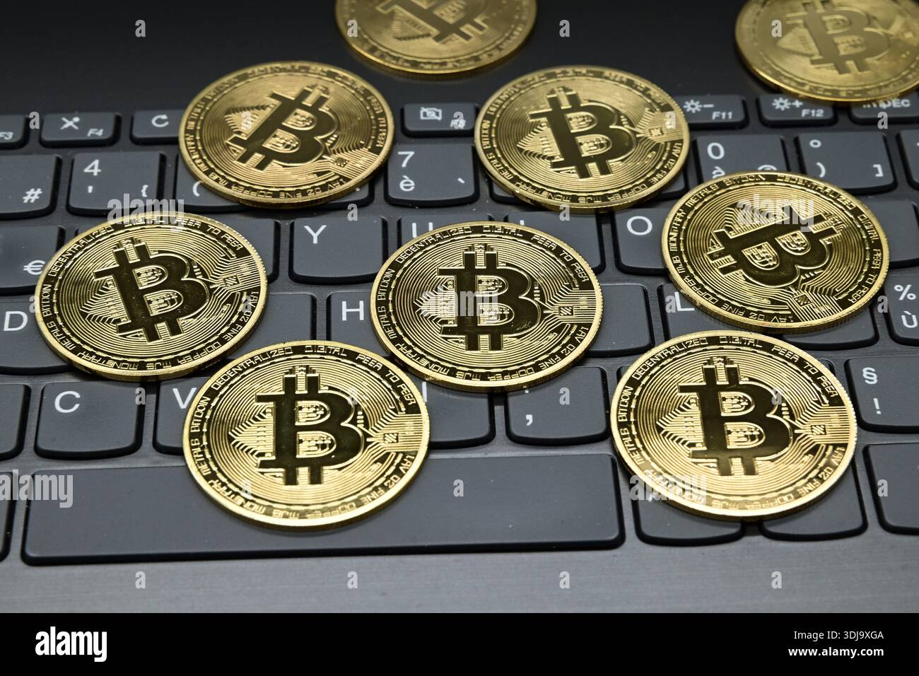 March 28, 2020, Veranne, Loire, France: Bitcoin cryptocurrency coins seen  displayed on a laptop keyboard. (Credit Image: © Romain Doucelin/SOPA  Images via ZUMA Press Wire) EDITORIAL USAGE ONLY! Not for Commercial USAGE!