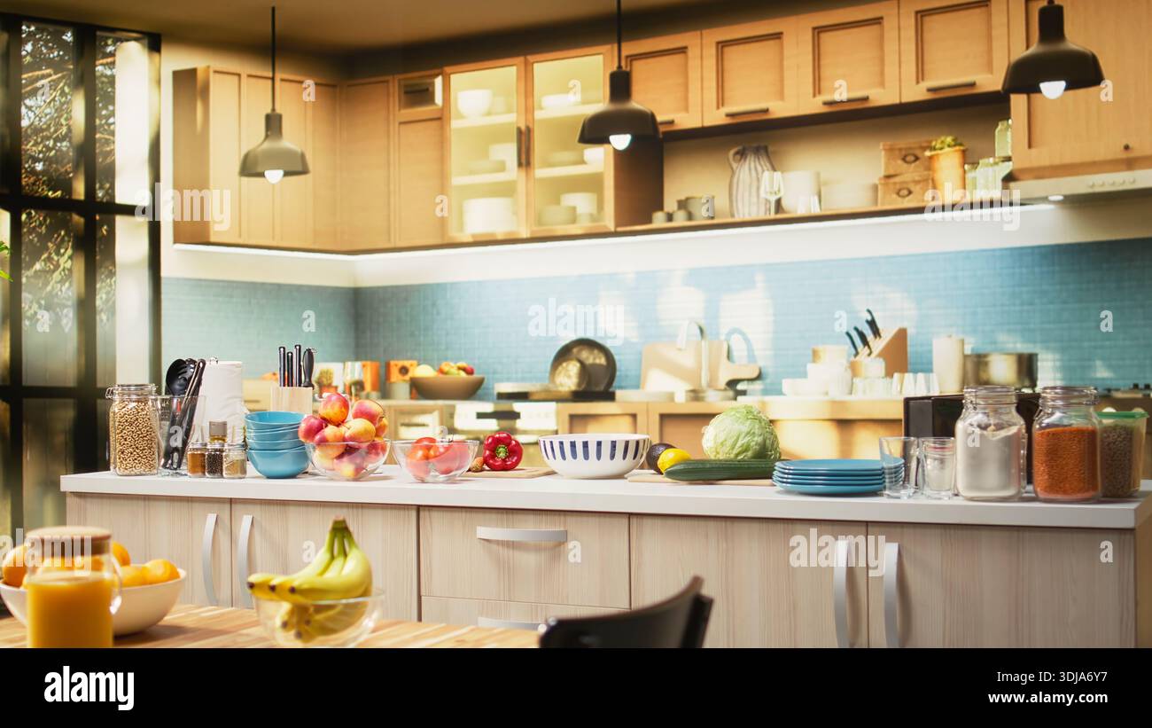 Empty modern kitchen interior in a contemporary apartment. Bright space includes a clean table, stylish kitchenware, fresh fruits and condiments on the counter. Healthy cooking in cozy home. Stock Photo