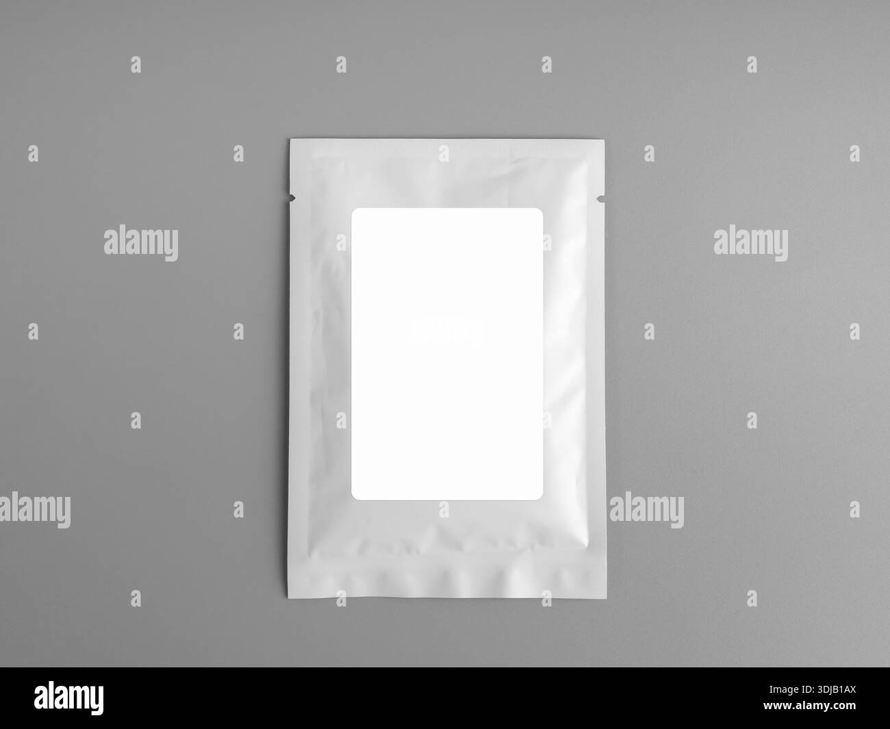 Blank white packaging pouch mockup on gray background, ideal for showcasing product branding, label design, food, supplement, cosmetic, or minimalist Stock Photo