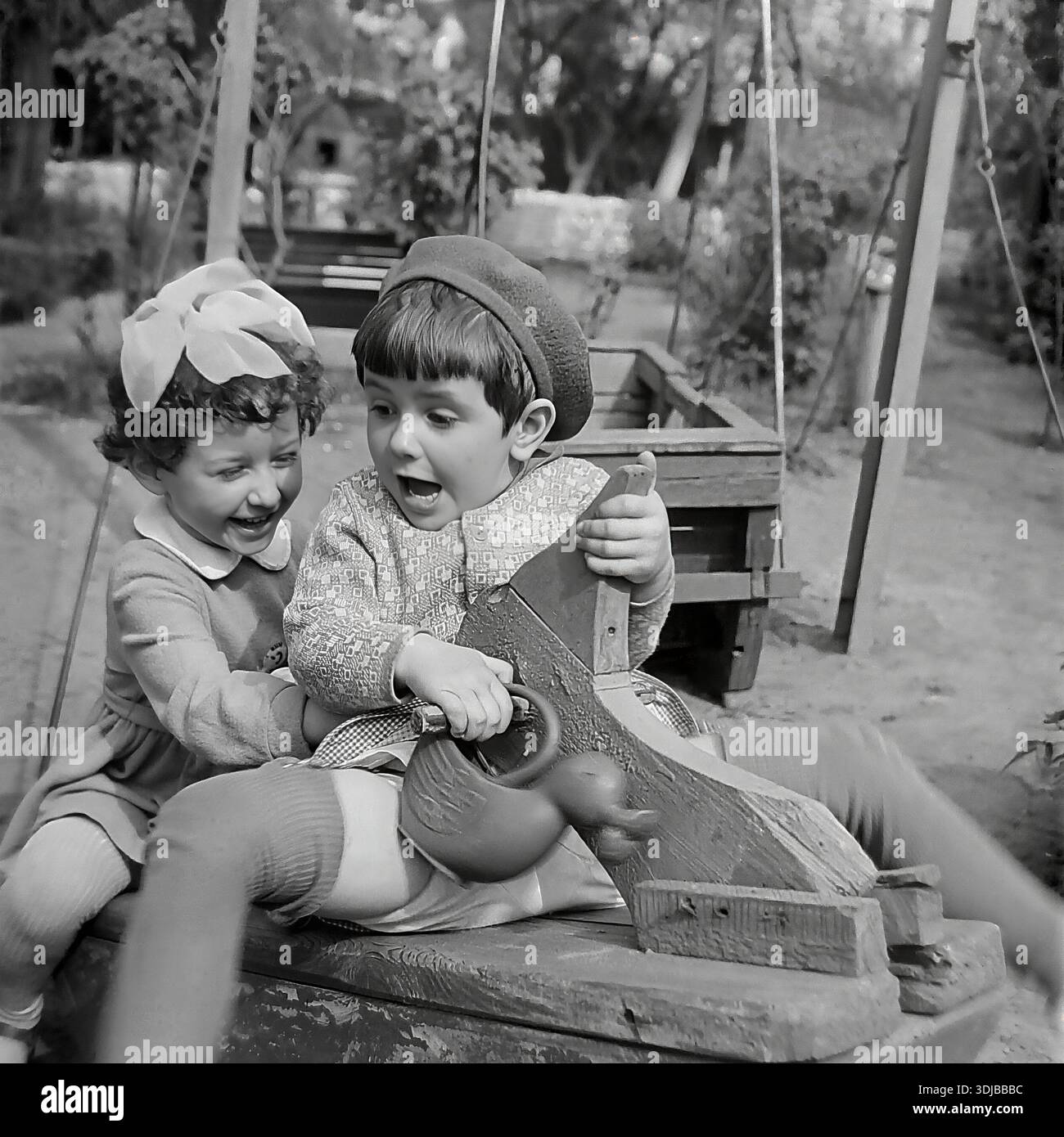 Children swing 1960s hi-res stock photography and images - Alamy